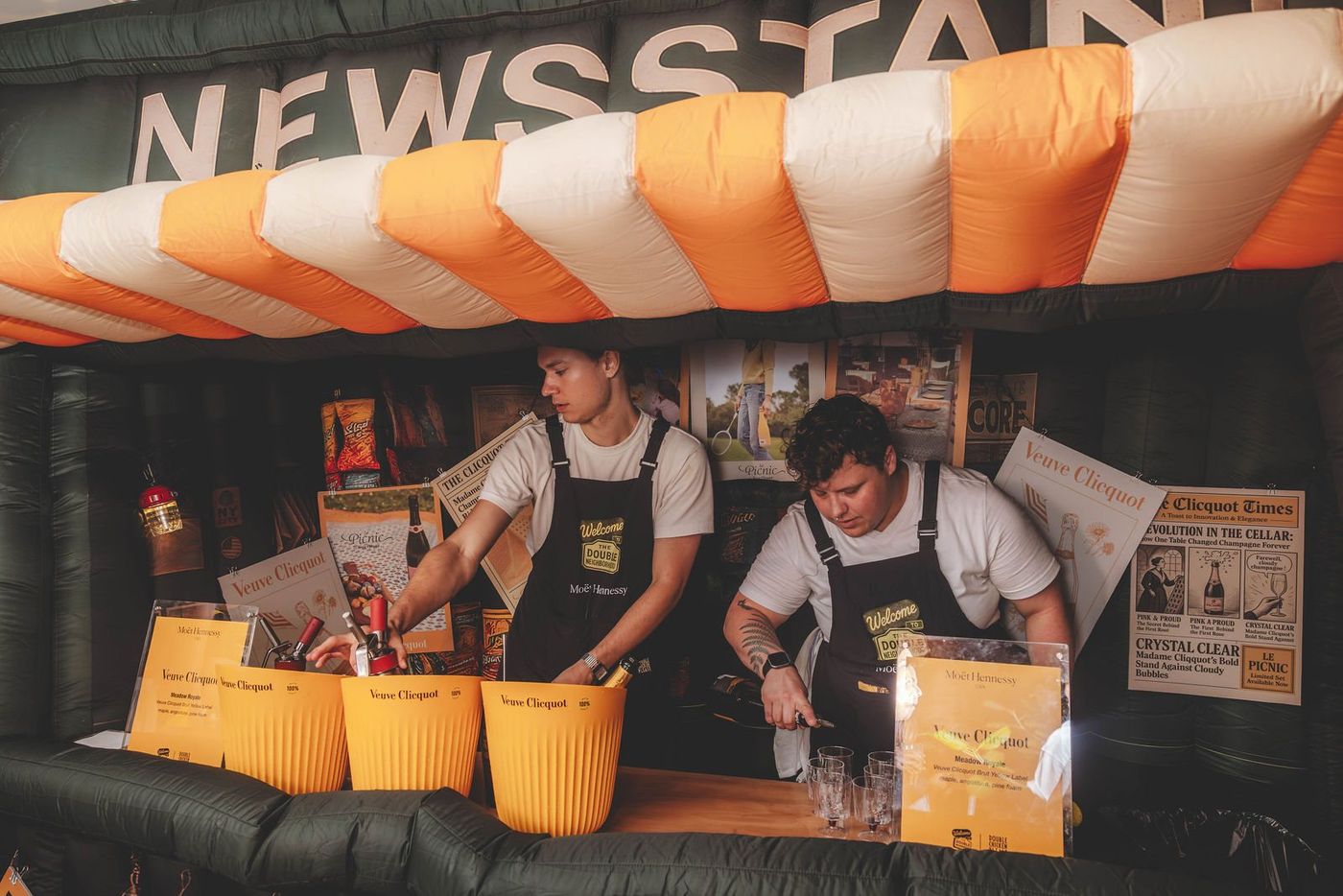 Bartenders inside the newsstand inflatable bar