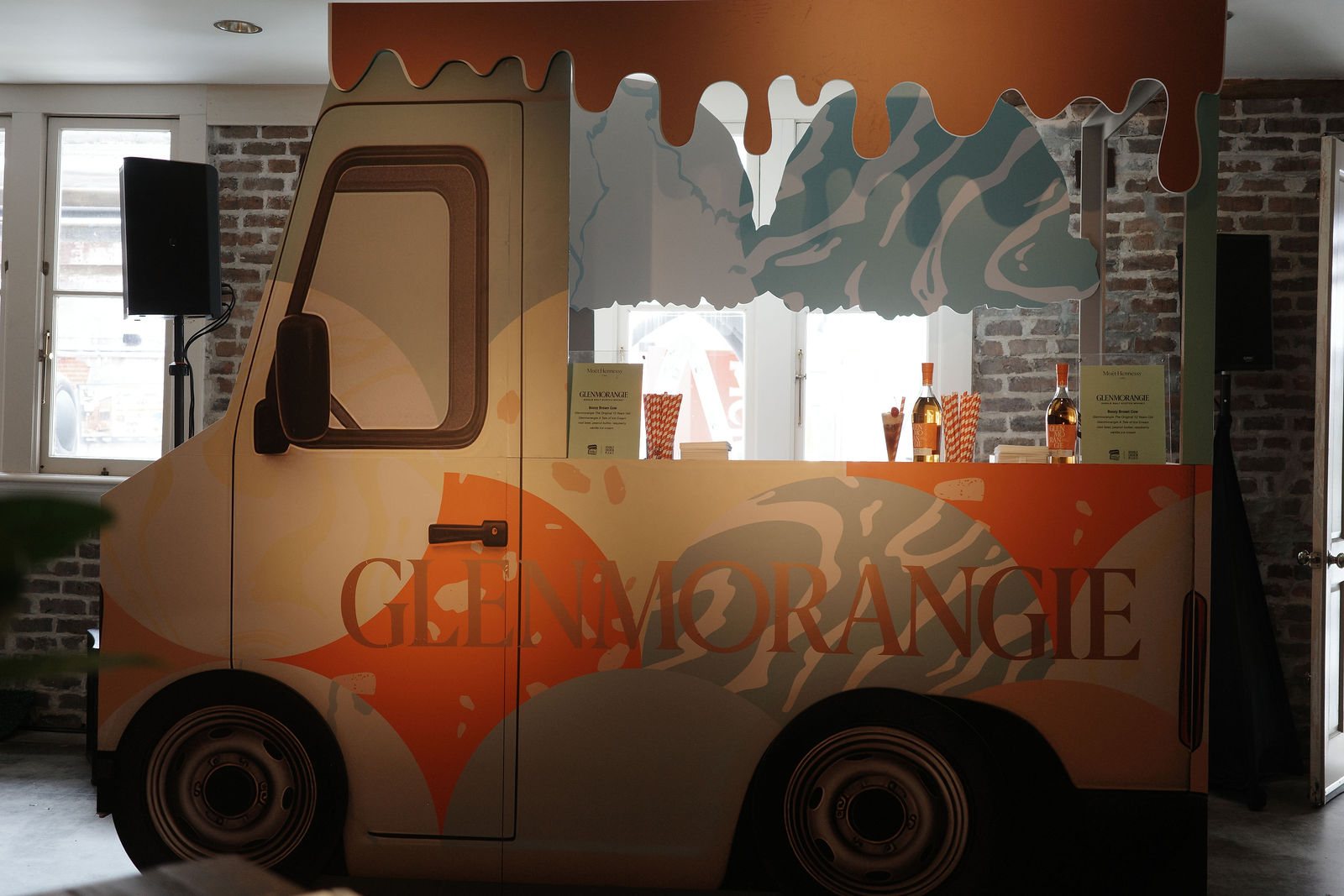 A Glenmorangie ice-cream-truck bar: a cut-out truck front with a drip-shaped top and bottles on the service counter
